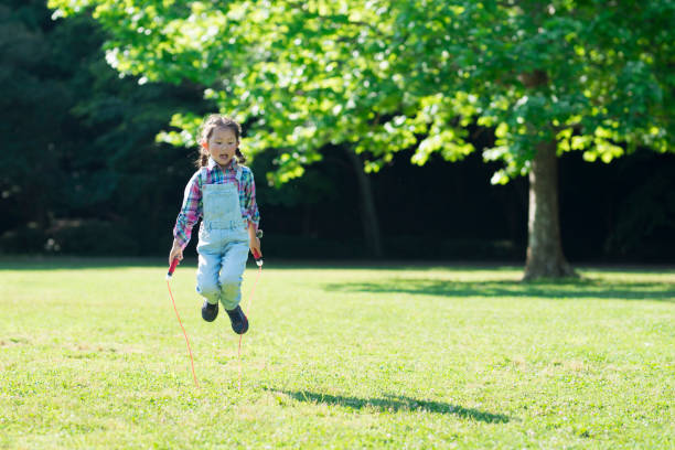 istock Girl playing with a jump rope 961885632
