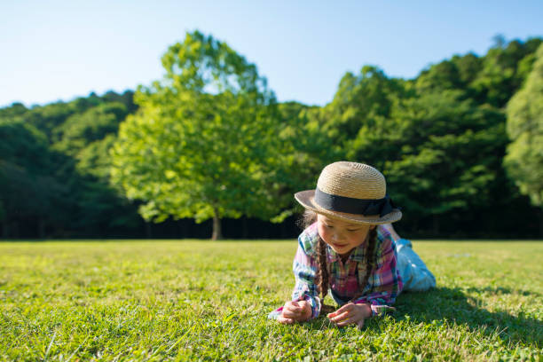 istock Girl lie down on the lawn 961885836