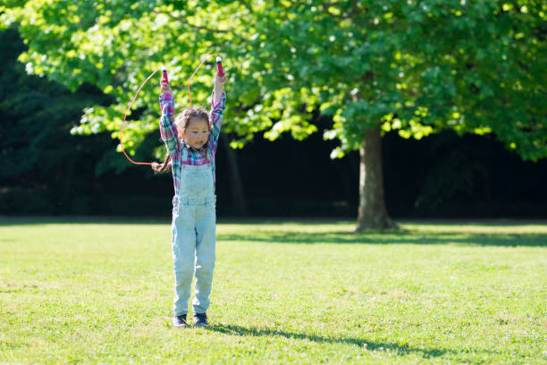 istock Girl playing with a jump rope 961885998