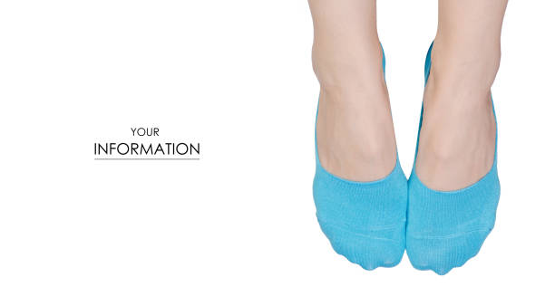 Female feet in no show socks pattern on white background isolation