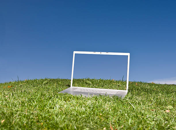 istock Laptop outdoors on a green field 96188782