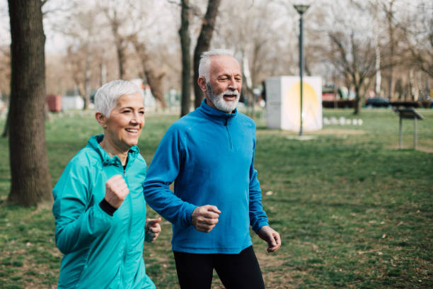 istock Senior couple jogging outdoors 961888366