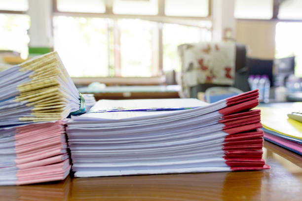 istock Pile of unfinished a bundle documents on office desk, Stack of business paper 961888800