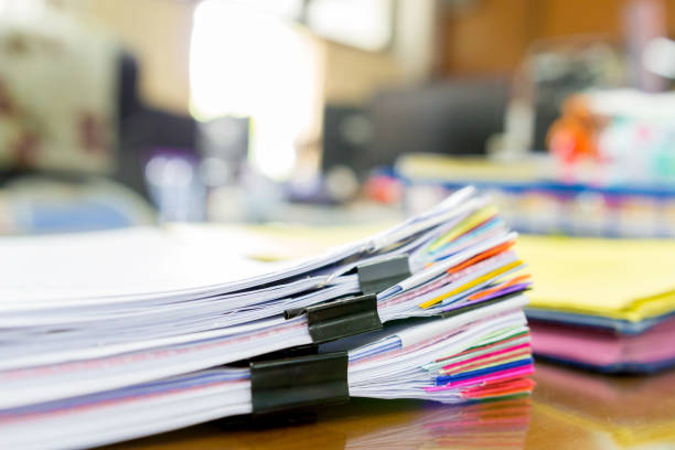 istock Pile of unfinished a bundle documents on office desk, Stack of business paper 961888802