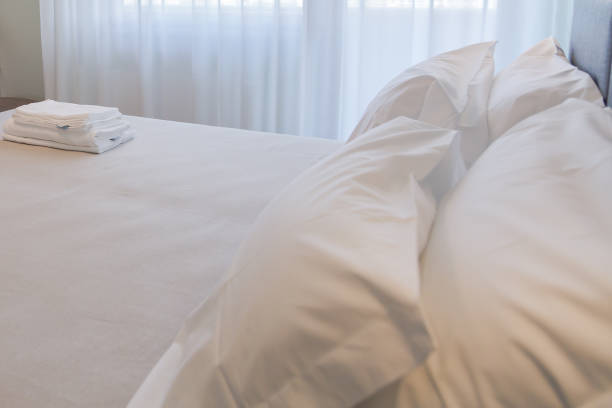 istock Bedroom. White towels on the bed 961889644