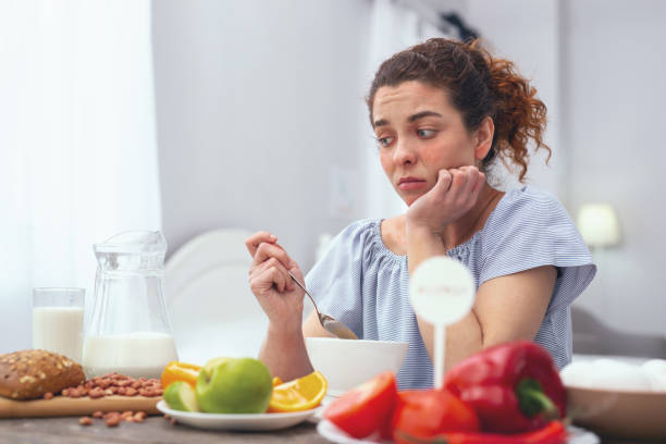istock Young woman experiencing lack of appetite 961897444