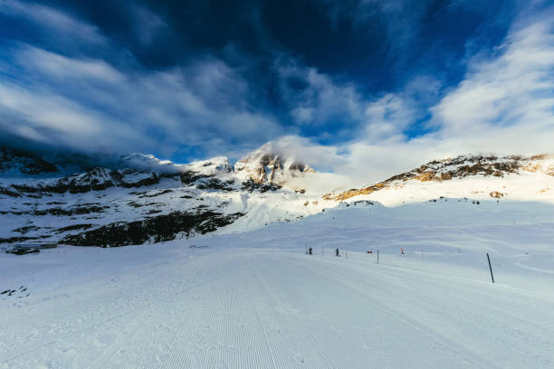 istock ski track on beautiful mountains landscape under blue sky, Austria 961901686