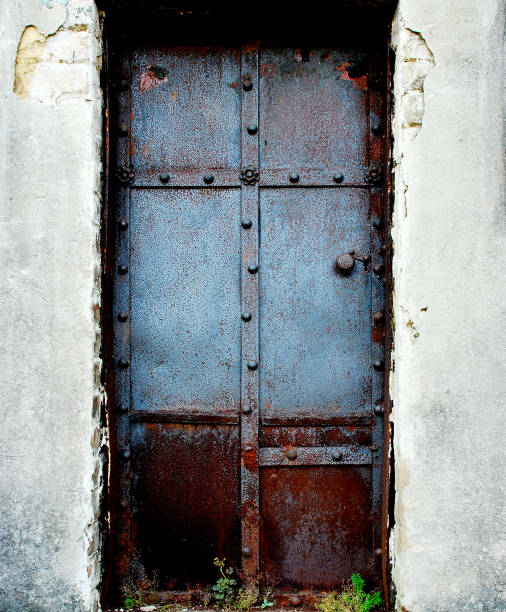An iron entrance is aged to tombs.