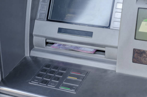 istock ATM gray metallic gives out money 961904392