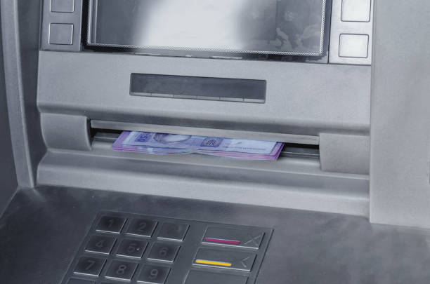 istock ATM gray metallic gives out money 961904454