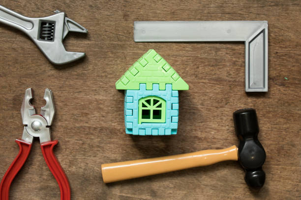 istock Home model object with toy equipment tool on wood background (Concept for home repair or fix) 961904458