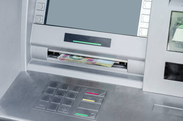 istock ATM gray metallic gives out money 961904638