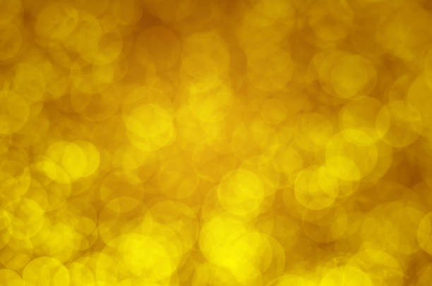 istock abstract yellow gold bokeh glitter sparkle background. 961904904