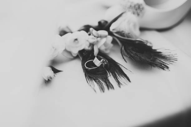 istock Two golden wedding rings isolated background concept 961905204