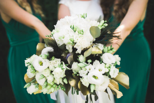 istock Bride holding big and beautiful wedding bouquet with flowers 961905862