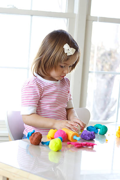 istock Girl playing with play dough 96190611
