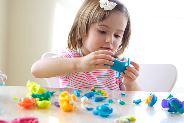 istock Girl playing with play dough 96190636