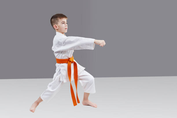 istock A boy with an orange belt is beating blow hand 961909326