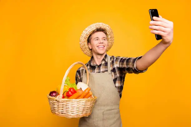 Modern technology telephone video-call internet roaming bag make social-network online shopping bio green grocery joy fun people concept. Funny funky guy photographing isolated background copy-space