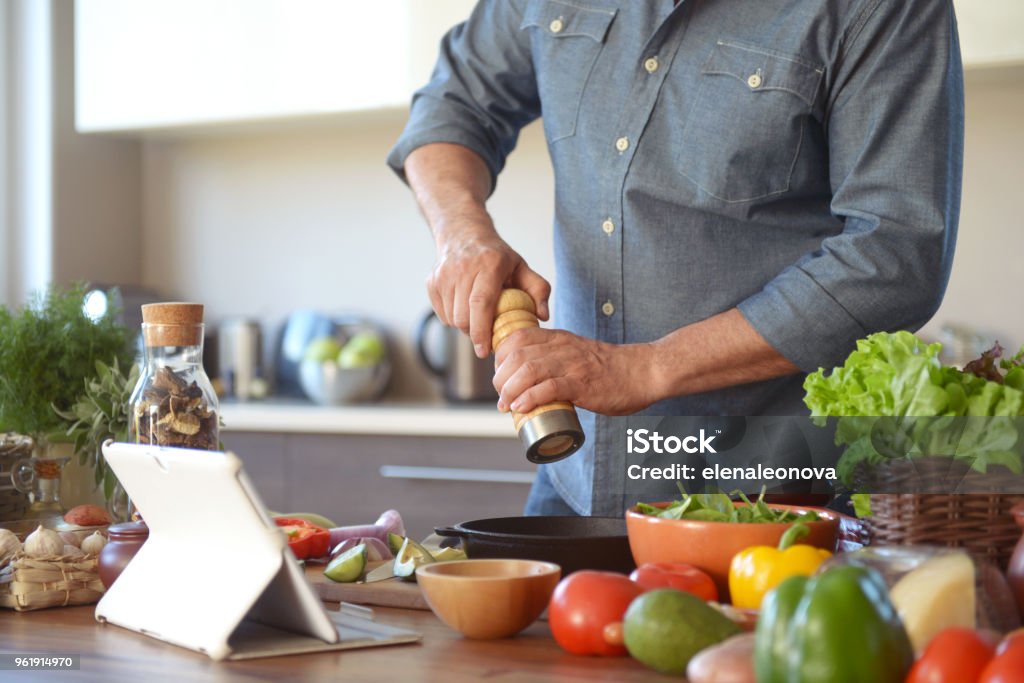 Man Cooking In Kitchen Man Cooking In The Kitchen Stock Photo - Download Image Now - Salt ...