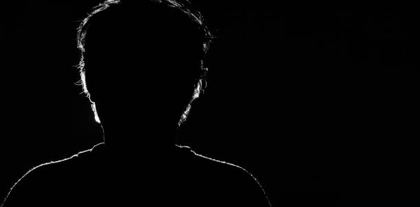 istock Unknown male person silhouette on black background 961916580