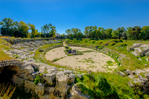 The Roman amphitheater of Syracuse is one of the early Imperial period remains that the city preserve. Together with other archaeological heritage, it is located in the ancient suburb of Neapolis, now become an archaeological park.