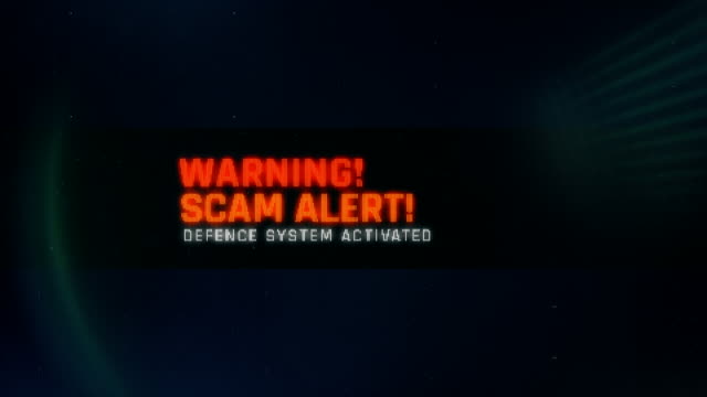 Scam alert, defence system activated, warning message on screen