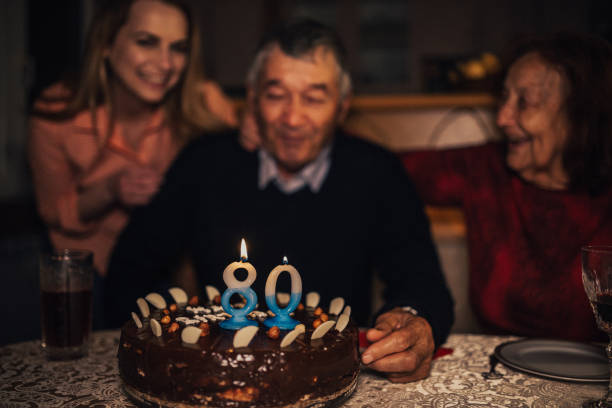 istock Grandfather having an 80th birthday celebration at home 961929250
