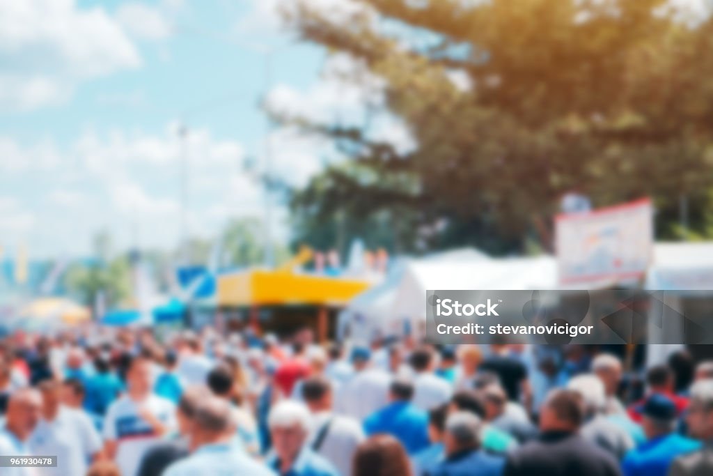 Crowd of people on open air festival Crowd of people on open air festival, abstract blurred background as graphic design element Traditional Festival Stock Photo