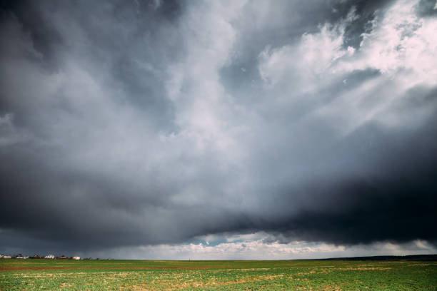 istock Countryside Rural Field Spring Meadow Landscape Under Scenic Dramatic Sky Before Rain. Rain Clouds On Horizon. Agricultural And Weather Concept 961931356