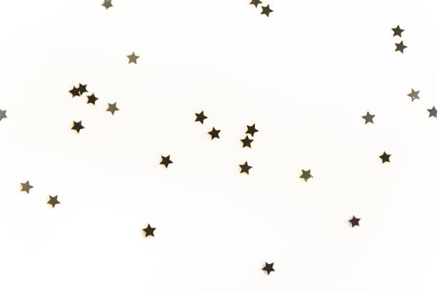 istock christmas golden confetti stars isolated on white background 961931364