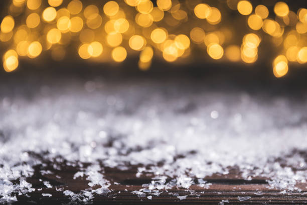 istock christmas background with snow and shiny blurred lights 961932642
