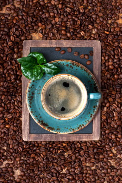 istock Top view of ceramic cup of coffee on dark background 961938050