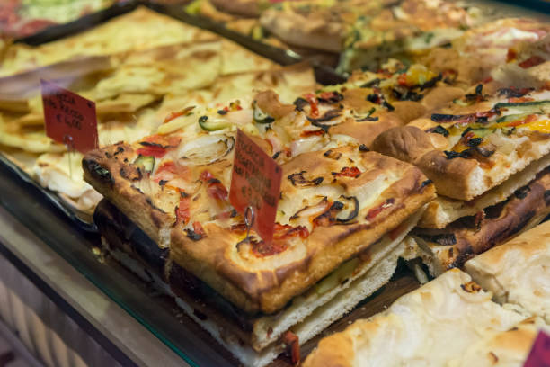 Local bakery selling delicious pizzas and focaccia bread. stock photo