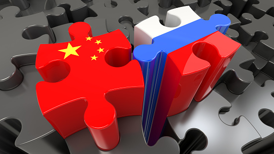 China and Russia flags on puzzle pieces. Political relationship concept. 3D rendering