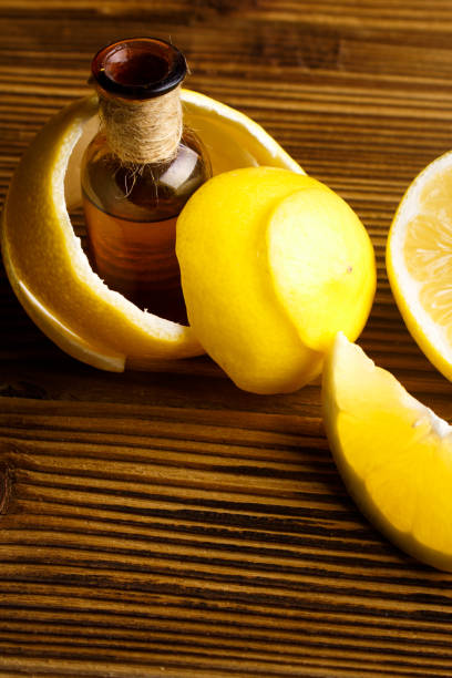 istock Lemon essential oil on a wooden background 961939810