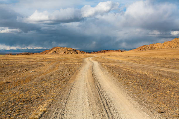 istock Road through the steppe and mountains of Western Mongolia. 961940392