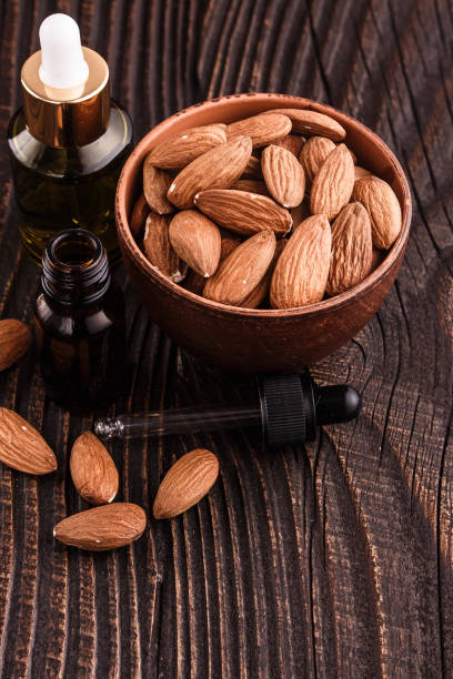 istock almond essential oil on a wooden background 961940914