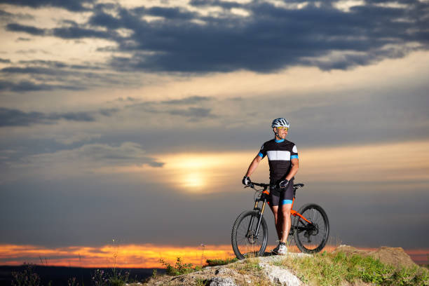 istock Robust and smiling cyclist posing near bike. 961945206