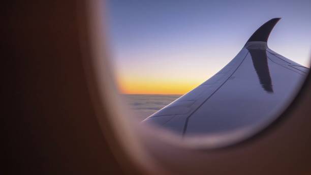istock Beautiful orange morning sunlight and airplane wing. 961953418