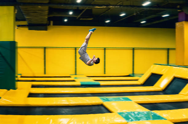 istock trampoline jumper performs acrobatic exercises on the trampoline 961954540