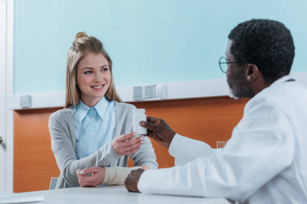 istock doctor giving plastic jar with pills 961956706