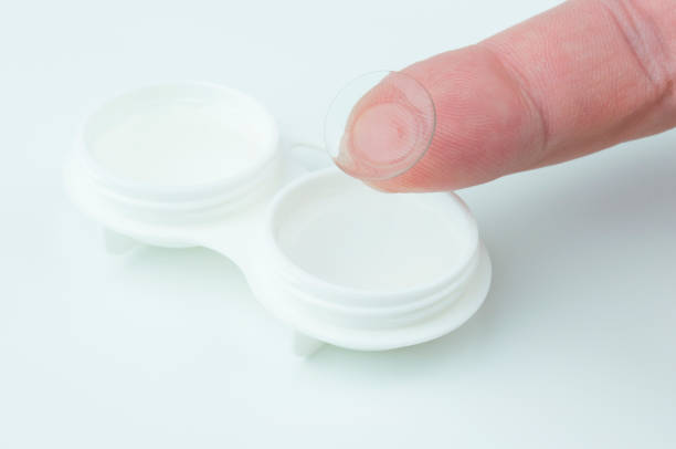istock Contact lens on a finger. 961960532