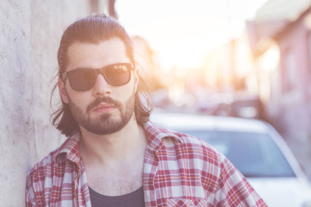istock Modern young man posing on the street. 961962182