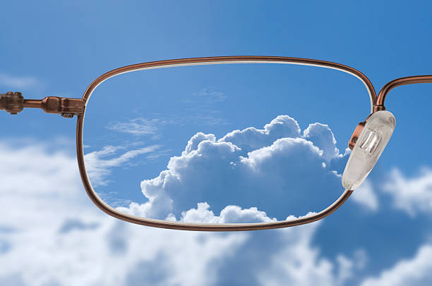 istock Bright blue sky with white clouds through a glasses lens 96196229