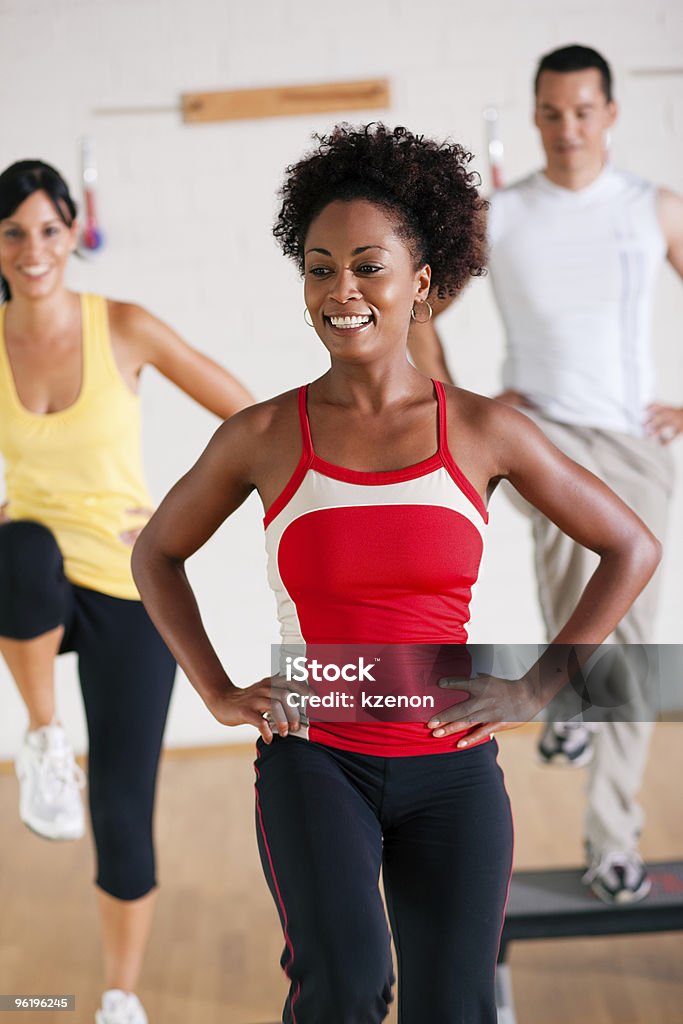 Step Training in gym with instructor  Exercising Stock Photo