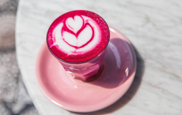 istock Colorful pink super latte on marble background 961962864