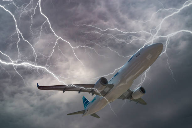 istock Passenger airplane flying on stormy sky with dark clouds and lightnings. 961962966
