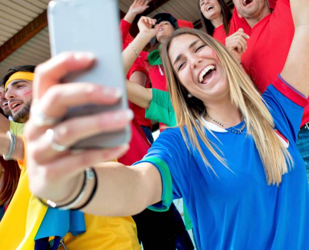 istock Supporter Girl Doing a Selfie 961967348