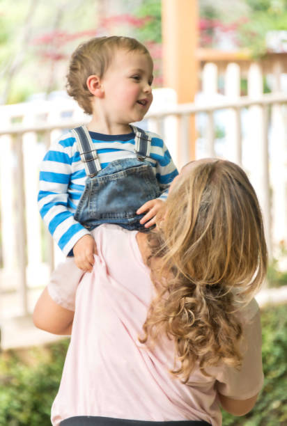 istock Mature woman playing with her toddler 961967400